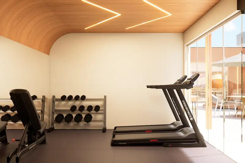 Área de cardio com forro curvo em madeira e vista para a varanda