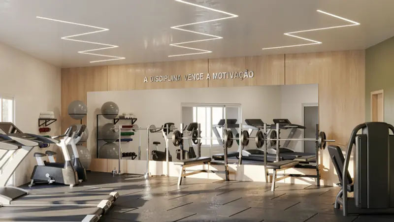 Academia de condomínio com espelhos, painel amadeirado e iluminação linear
