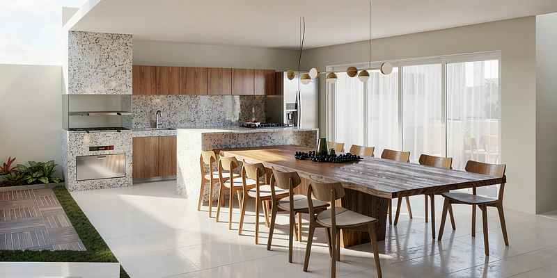 Área gourmet com mesa comprida, bancada em pedra e vista para o jardim